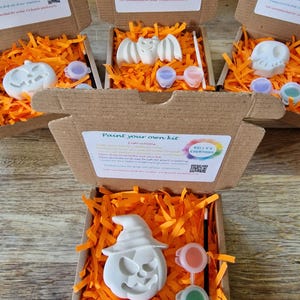 Paint you own Halloween shape with orange shredded protective paper, paint and brush