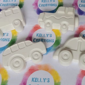 May include: Five white ceramic car figurines, each with a different design. The cars are ready to be painted.