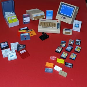 COMMODORE 64 - DRIVE 1541 - MONITOR 1702-Manuals-Disk 5,25-Joystick-Datasette 1530-Cassette games-Cartridge-Diskette box-Miniature-Souvenir