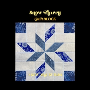 May include: A square quilt block featuring a central star pattern made of blue fabric with white snowflake prints and solid grey fabric. The text Snow Flurry Quilt BLOCK and S&W SHE BUILDS is printed on the image. The design uses geometric shapes.
