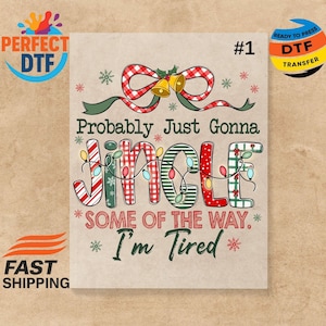 May include: A beige DTF transfer featuring the text "Probably Just Gonna Jingle Some of the Way. I'm Tired." The word "Jingle" is decorated with Christmas lights and patterns. A red and white plaid bow and bells are at the top.