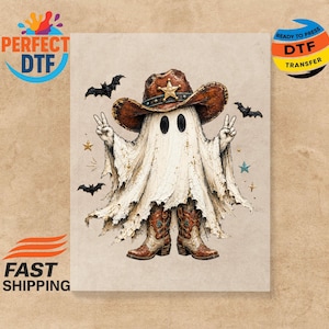 May include: A DTF transfer print featuring a ghost wearing a brown cowboy hat with a gold star badge and brown cowboy boots. The ghost is making peace signs with both hands. The design includes small black bats and colorful stars on a beige background.