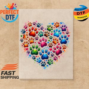 May include: A heart shape made of multi-coloured paw prints. The design includes red, orange, yellow, green, blue, and purple paw prints. The words "PERFECT DTF" and "READY TO PRESS DTF TRANSFER" are visible.