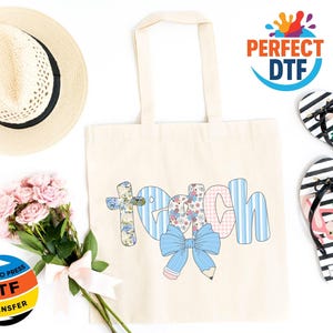 May include: Cream-colored tote bag with the word "Teach" in a colorful design, featuring a cross, bow, and pencil. Includes a straw hat, pink flowers, and black and white striped flip-flops with flamingo graphics.