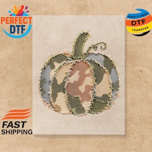 May include: A pumpkin graphic design featuring a camouflage pattern in shades of olive green, tan, and brown. The pumpkin has a frayed, stitched edge effect and a textured green stem with a small curly vine detail on a light beige background.