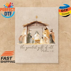 May include: Watercolor illustration of a Nativity scene with figures under a wooden shelter, topped with a star. The text "the greatest gift of all" and Matthew 1:21 are written below the scene. The image has a neutral background.
