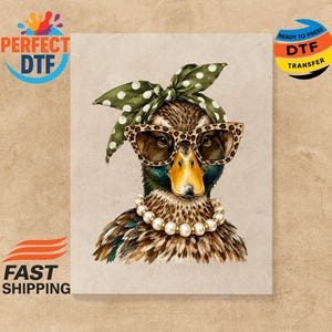 May include: A graphic illustration of a duck wearing leopard print sunglasses, a white pearl necklace, and a green headscarf with white polka dots. The duck has brown and black feathers and a yellow beak. The background is a solid light beige color.