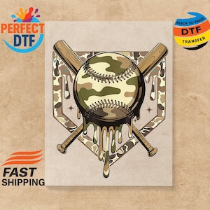 May include: A baseball with a camouflage pattern, crossed bats, and a home plate design. The baseball appears to be melting, with dripping camouflage-coloured paint. The image includes the text "PERFECT DTF" and "READY TO PRESS DTF TRANSFER".
