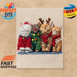 May include: Embroidered image of four smiling cats dressed for the holidays. One cat wears a Santa hat and red sweater, another a Christmas tree outfit, and two wear reindeer antlers and red scarves. The image is ready to press.