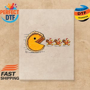 May include: A humorous graphic featuring a pie slice resembling Pac-Man chasing three cartoon turkeys. The design is on a light beige background. The image includes the text "PERFECT DTF" and "READY TO PRESS DTF TRANSFER".