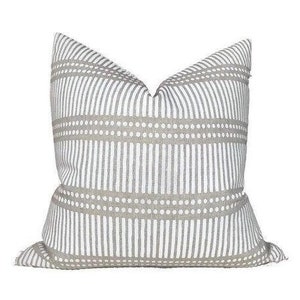 May include: A gray and white striped throw pillow with a subtle dotted pattern. The pillow is made of a soft, textured fabric.
