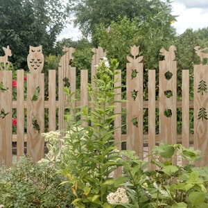Garden decoration made of WOOD, wooden fence with animal motif, garden fence as garden decoration