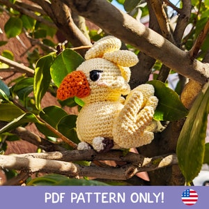 May include: A crocheted yellow bird with orange beak and black eyes. The bird is sitting on a tree branch. The image includes the text "Chirpy Crochet" and "PDF Pattern Only!"
