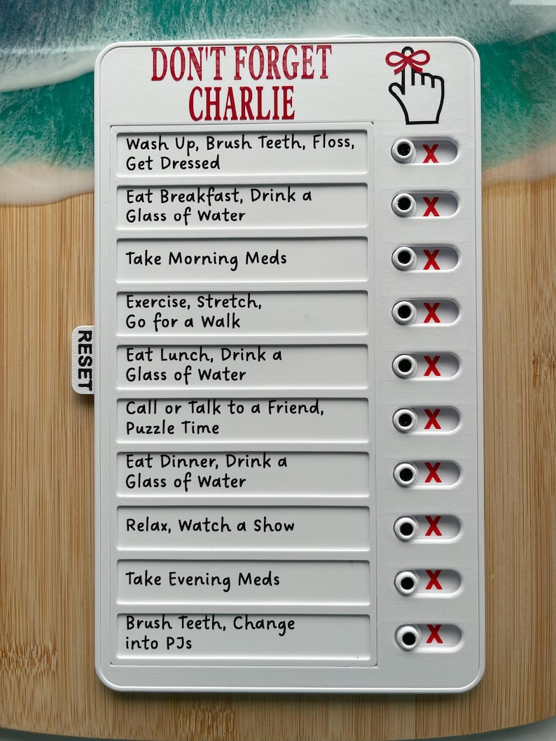 May include: A white daily checklist with the text "DON'T FORGET CHARLIE" in red. The checklist includes tasks like "Wash Up, Brush Teeth, Floss, Get Dressed" and "Eat Breakfast, Drink a Glass of Water". Each task has a check box.
