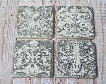 Set of four grey Grecian coasters