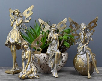 Pretty Golden Fairies With Metal Wings...