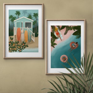 Set de 2 carteles A3 playa de arena rosa y surf en el Caribe