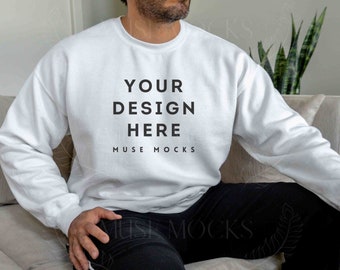May include: White sweatshirt with the text "YOUR DESIGN HERE" and "MUSE MOCKS" printed on the front.