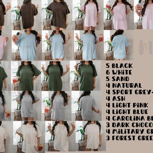 May include: A variety of oversized t-shirts in different colors, including black, white, sand, natural, sport grey, ash, light pink, light blue, Carolina blue, dark chocolate, military green, and forest green. 5 Black, 6 White, 5 Sand, 4 Natural, 4 Sport Grey-L, 4 Ash, 4 Light Pink, 4 Light Blue, 4 Carolina Blue, 3 Dark Chocolate, 4 Military Green, 3 Forest Green.