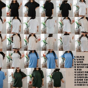 May include: A variety of oversized t-shirts in different colors, including black, white, sand, natural, light pink, light blue, Carolina blue, dark chocolate, military green, and forest green. The shirts are all made of a soft, comfortable material and are perfect for everyday wear.