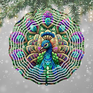May include: A round, colorful peacock ornament with a detailed mandala design. The peacock is depicted in shades of blue, green, purple, and gold. The ornament is decorated with white wavy lines and is set against a snowy, gray background.