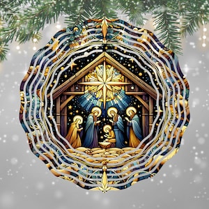 May include: A round Christmas ornament featuring a Nativity scene. The illustration depicts the Holy Family and the Three Wise Men in a stable, with a star above. The ornament has a wavy, layered design with gold, blue, and brown tones.