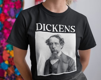 May include: A black t-shirt with a white graphic of Charles Dickens's portrait and the word "DICKENS" above it.