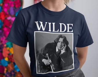 May include: A navy blue t-shirt with a white print of Oscar Wilde's portrait and the word "WILDE" above it.