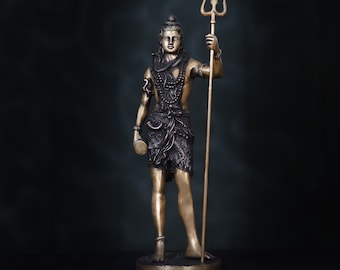 May include: A bronze statue of the Hindu deity Shiva, holding a trident in his right hand and a drum in his left. He is wearing a beaded necklace and a loincloth. The statue is standing on a circular base.