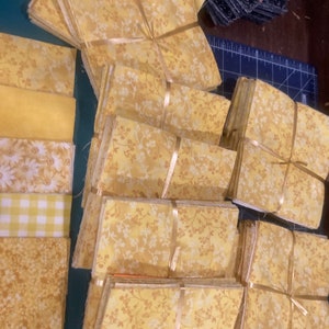 21-233 - New packs - Light Yellow Blends and White - 5 by 5 inch squares - 4 ea of 10 fabrics per set- Total of 40  some prints have changed
