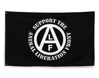 Pode incluir: Bandeira preta com um círculo branco contendo um símbolo de anarquia com as letras "A", "L" e "F" dentro. O círculo é rodeado pelo texto "Apoie o Frente de Libertação Animal".