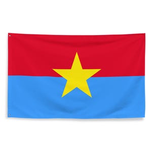 May include: A rectangular flag featuring a horizontal bicolor design with a red upper half and a light blue lower half. A large, five-pointed yellow star is centered across the middle, overlapping both the red and blue sections of the fabric.