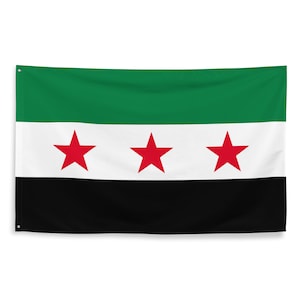 May include: A green, white, and black flag with three red five-pointed stars. The flag is made of fabric and is hanging from a pole.