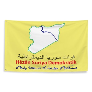 May include: Yellow flag with a white outline of a map, green border, and blue river. The flag has text in Arabic, English, and another language. The flag is rectangular and has grommets in the corners.