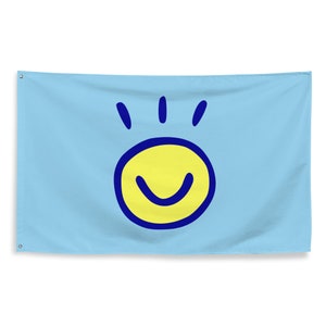 May include: A light blue flag with a yellow smiley face outlined in blue. The smiley face has three blue lines above it.