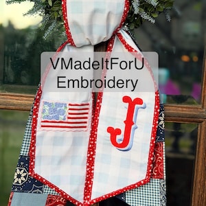 May include: A patriotic banner with a white and blue gingham pattern, red star trim, and a patch of the American flag. The banner also features a red and blue embroidered letter "J" and the text "VMadeltForU Embroidery".