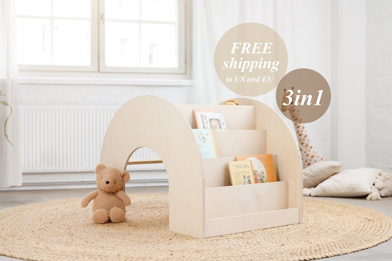 May include: A light wood children's bookshelf shaped like an archway with three shelves. The bookshelf is on a light brown rug with a teddy bear sitting in front of it. The text "FREE shipping to US and EU" and "3 in 1" are visible in the image.