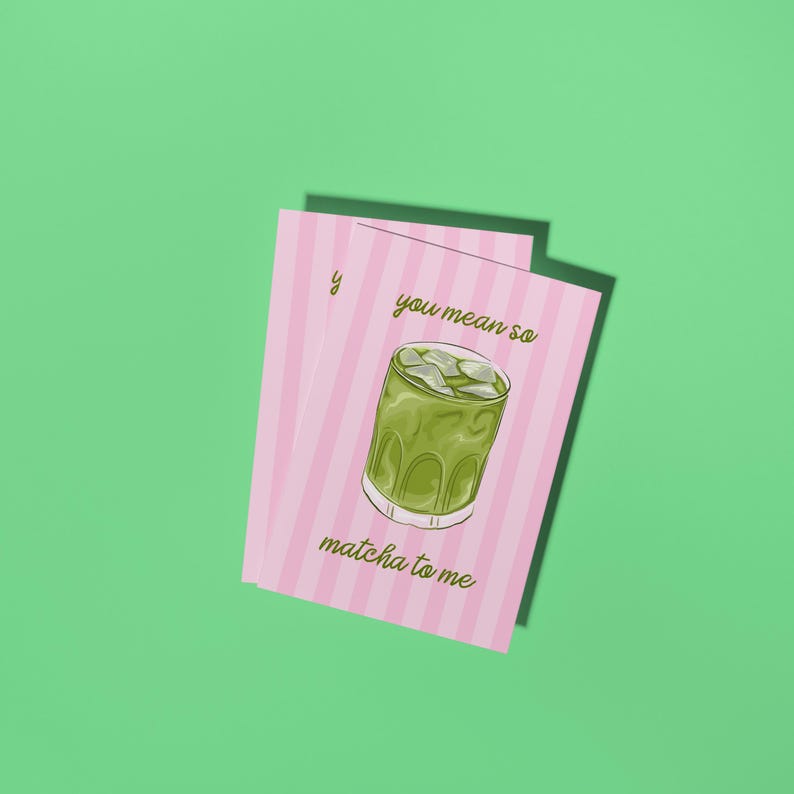 May include: Two pink cards with vertical white stripes and the text "you mean so matcha to me". The cards feature a green matcha drink with ice. The background is a solid green.