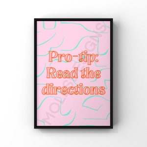 May include: A pink and teal abstract print with the text "Pro-tip: Read the directions" in orange.