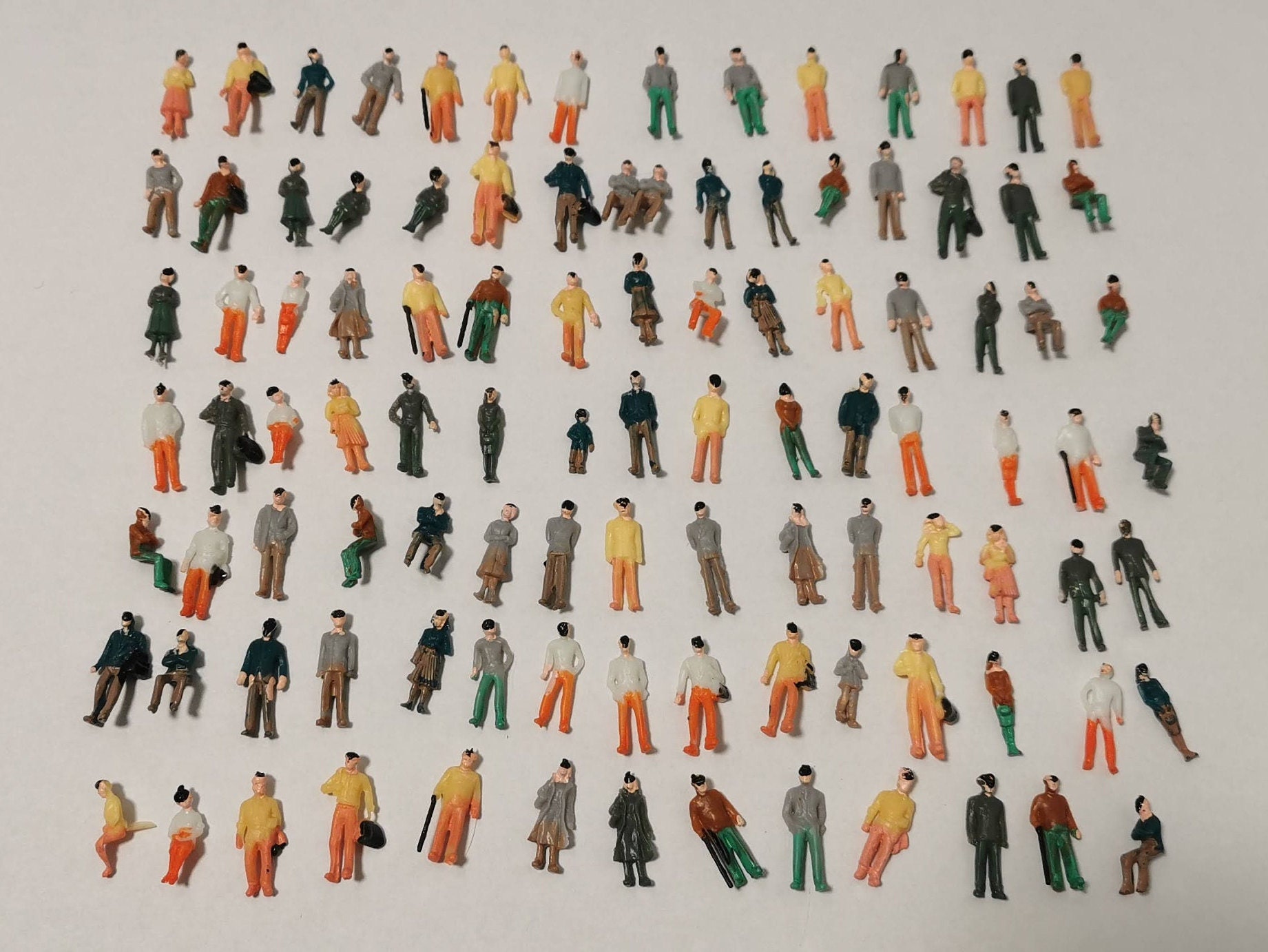 Artist Uses Miniature Railway Figurines to Create Lifelike Images