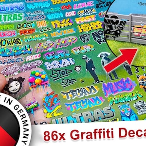 May include: A sheet of 86 colourful graffiti decals featuring words like "ULTRAS", "HIP HOP", "BERLIN", "TEXAS", and "MUSIC". The decals are printed on clear sheets and are ready to be applied to any surface.