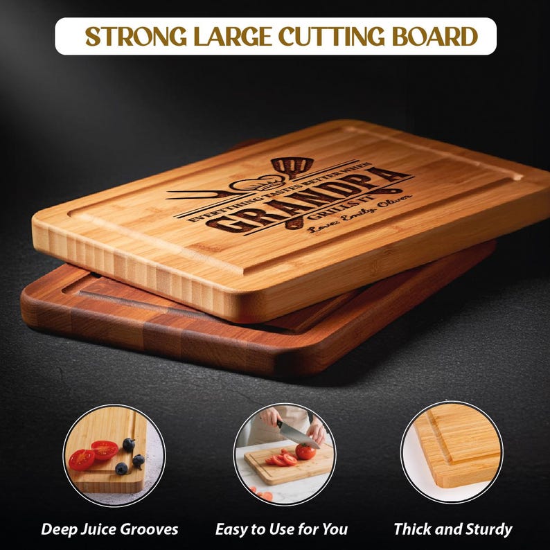 May include: Two wooden cutting boards, one light-colored and one dark, are stacked. The top board has the text "STRONG LARGE CUTTING BOARD" and "GRANDPA GRILLS IT" engraved. The bottom board is a darker wood. The image also shows details of the boards, including deep juice grooves.