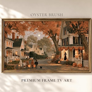 May include: A framed digital art print titled OYSTER BRUSH PREMIUM FRAME TV ART depicting a neighborhood street scene at dusk during autumn. The image features white houses, orange-leafed trees, a full moon, and children in costumes with jack-o'-lanterns.