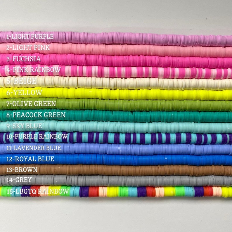 May include: A close-up of 15 rows of colorful polymer clay beads. The beads are arranged in rows, with each row representing a different color. The colors are: light purple, light pink, fuchsia, pink rainbow, beige, yellow, olive green, peacock green, sky blue, purple rainbow, lavender blue, royal blue, brown, grey, and LGBTQ rainbow.