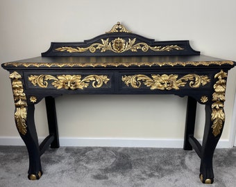 Stunning carved writing desk with Green Man motives gilded with golden leaves