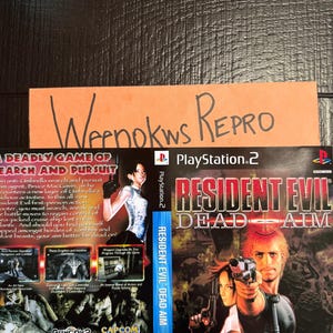 May include: A PlayStation 2 video game case insert for Resident Evil Dead Aim. The front cover features a character holding a handgun, while the back displays game screenshots, a synopsis, and technical specifications. A handwritten note reads Weenokws Repro.