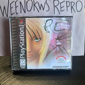 May include: A PlayStation game case for the game "Parasite Eve" with a mature rating. The case features a woman with blonde hair and blue eyes on the front. The background is a purple and pink gradient with a red-haired woman in a black dress.