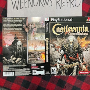 May include: PlayStation 2 video game case for Castlevania Curse of Darkness. The front cover features a dark, gothic illustration of a character with a sword. The back cover has a description of the game and a mature rating.