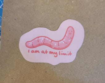 Può includere: Sticker a forma di verme rosa con glitter e il testo "I am at my limit".