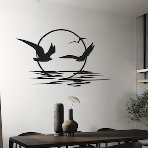 Metalen muurkunst zonsopgang: minimalistisch decor met zeemeeuwen